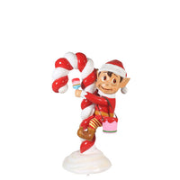 Red Elf On Candy Cane Statue