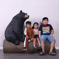 Black Bear on Tree Trunk Statue